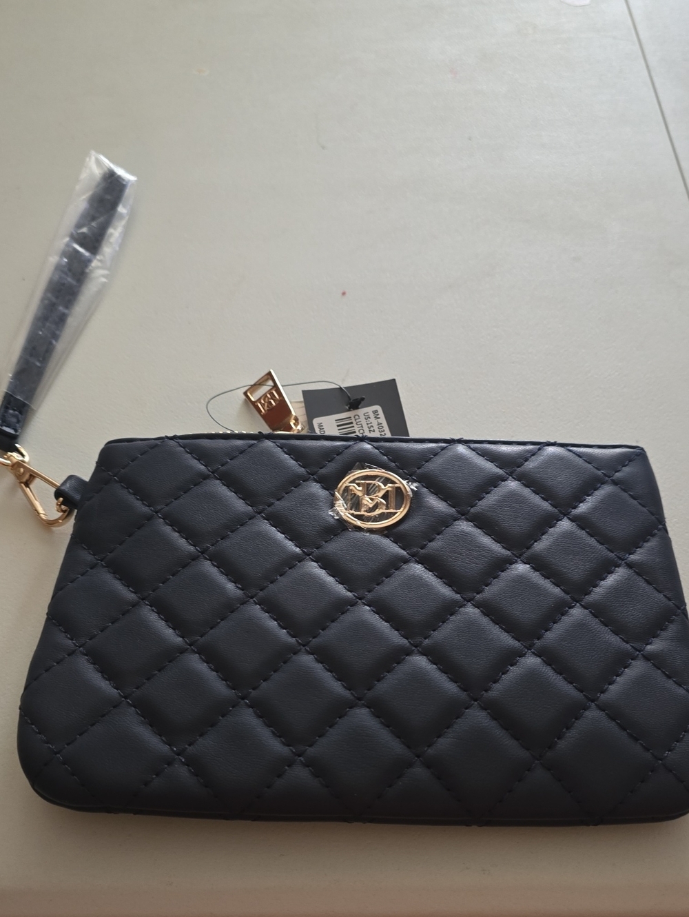Badgley Mischka Quilted Navy Wristlet with Gold Emblem